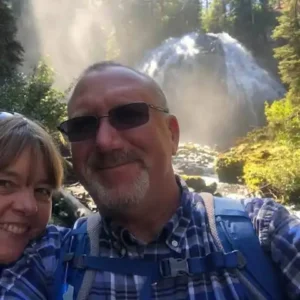 David Cobb, founder of Cascade Custom Creations, with Holli at a waterfall
