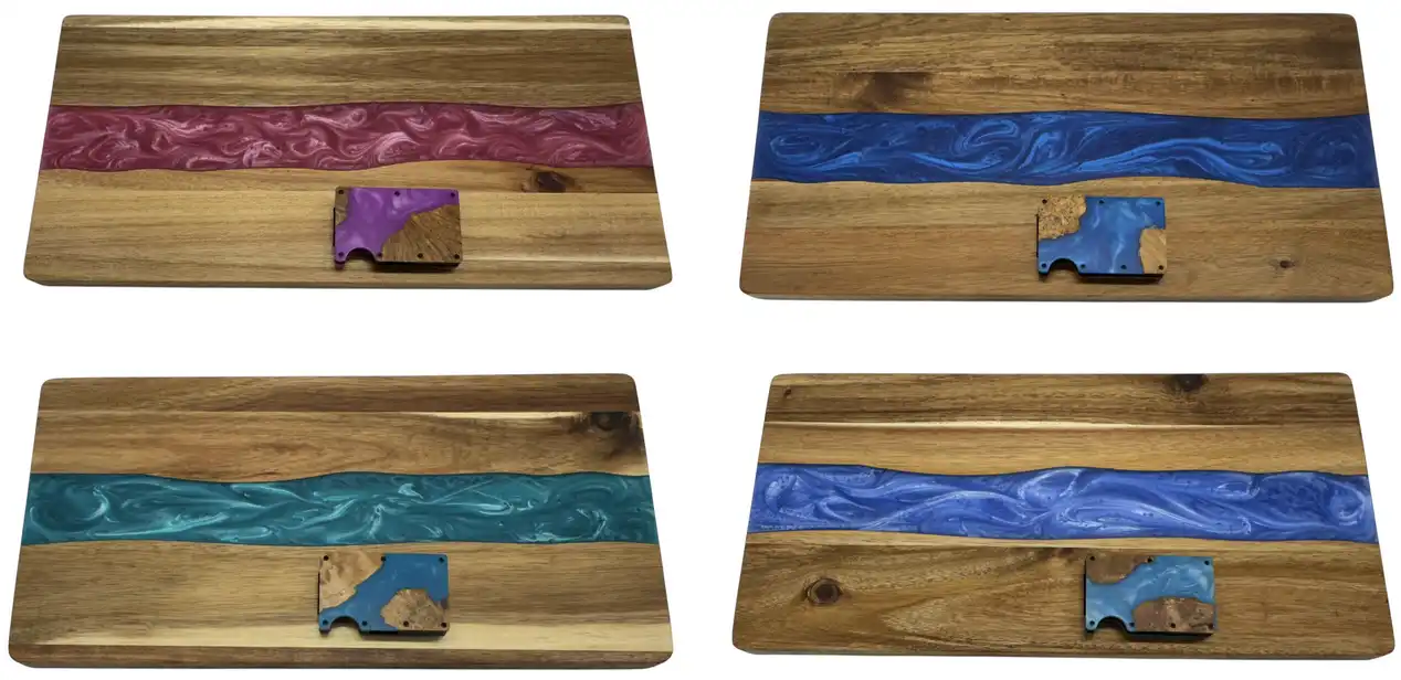 Four handcrafted hardwood cutting boards with pink, blue, teal and purple epoxy river inlays