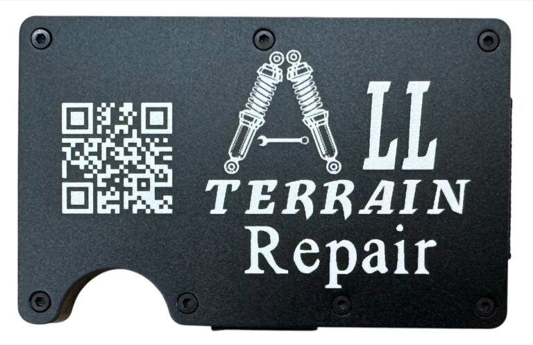 All Terrain Repair logo and QR code laser engraved on a black metal wallet