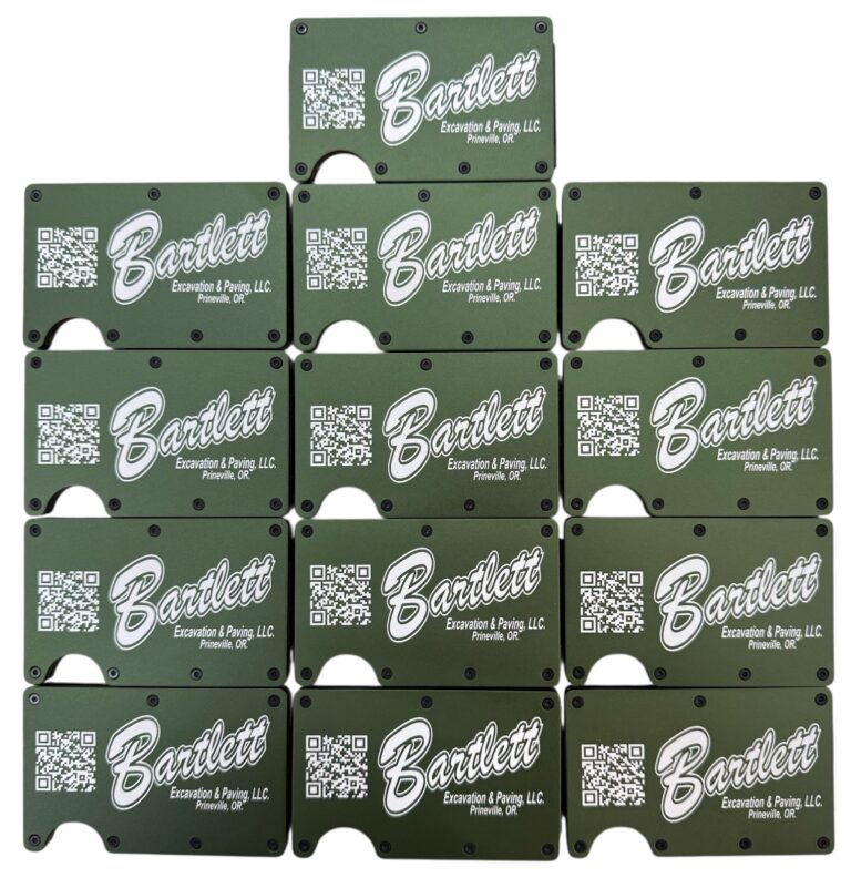 Bartlett Excavation and Paving logo and QR code laser engraved on a set of army green metal wallets