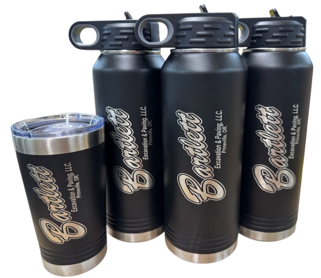 Bartlett Excavation and Paving logo laser engraved on black water bottles and a tumbler
