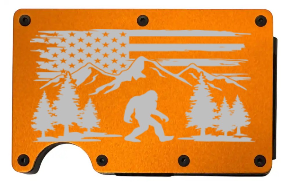 Bigfoot laser engraved on a orange metal wallet