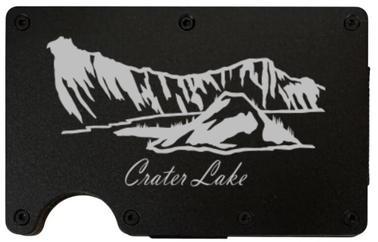 Crater Lake laser engraved on a black metal wallet
