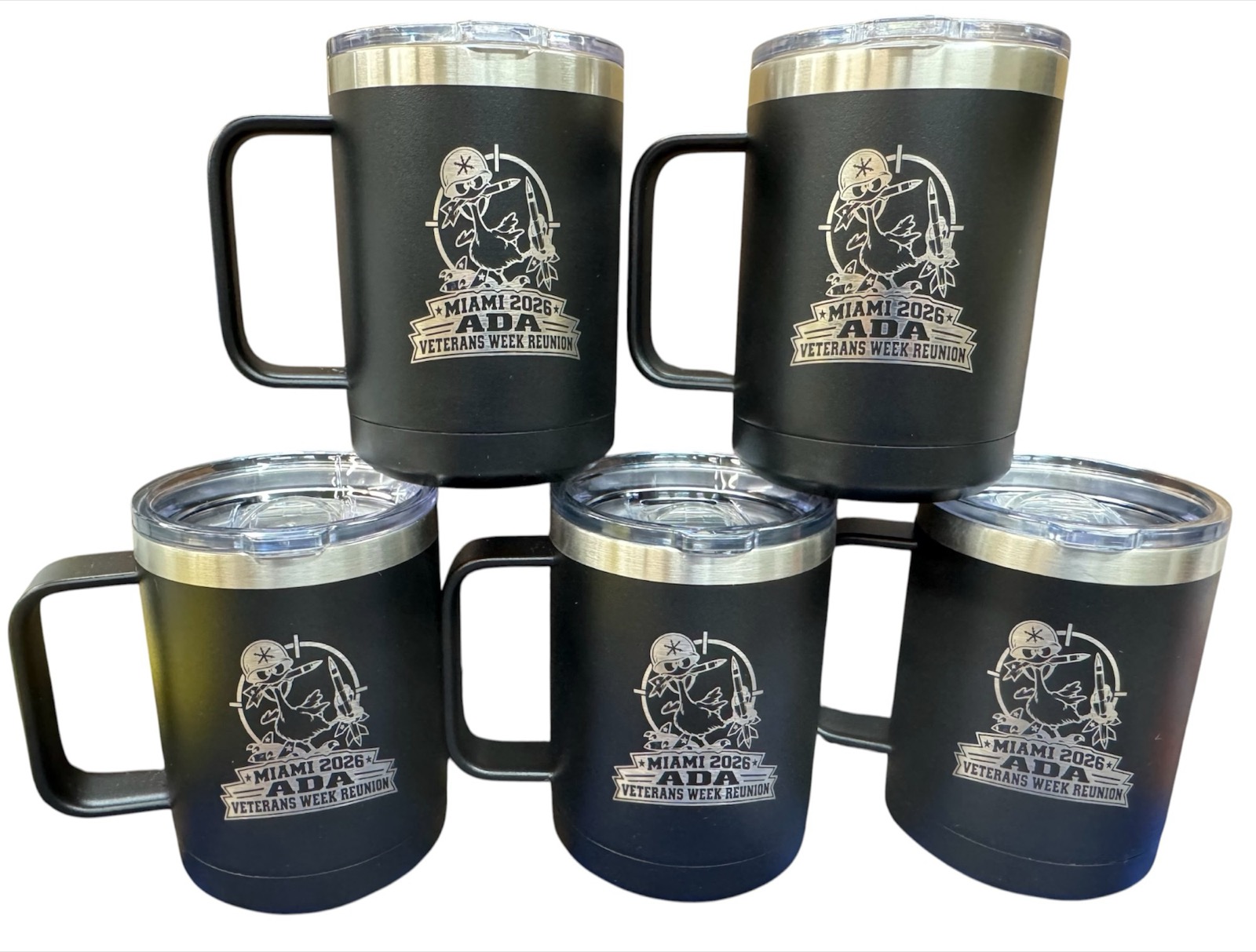 Five black handled mugs laser engraved with the Miami 2026 ADA Veterans Week Reunion logo