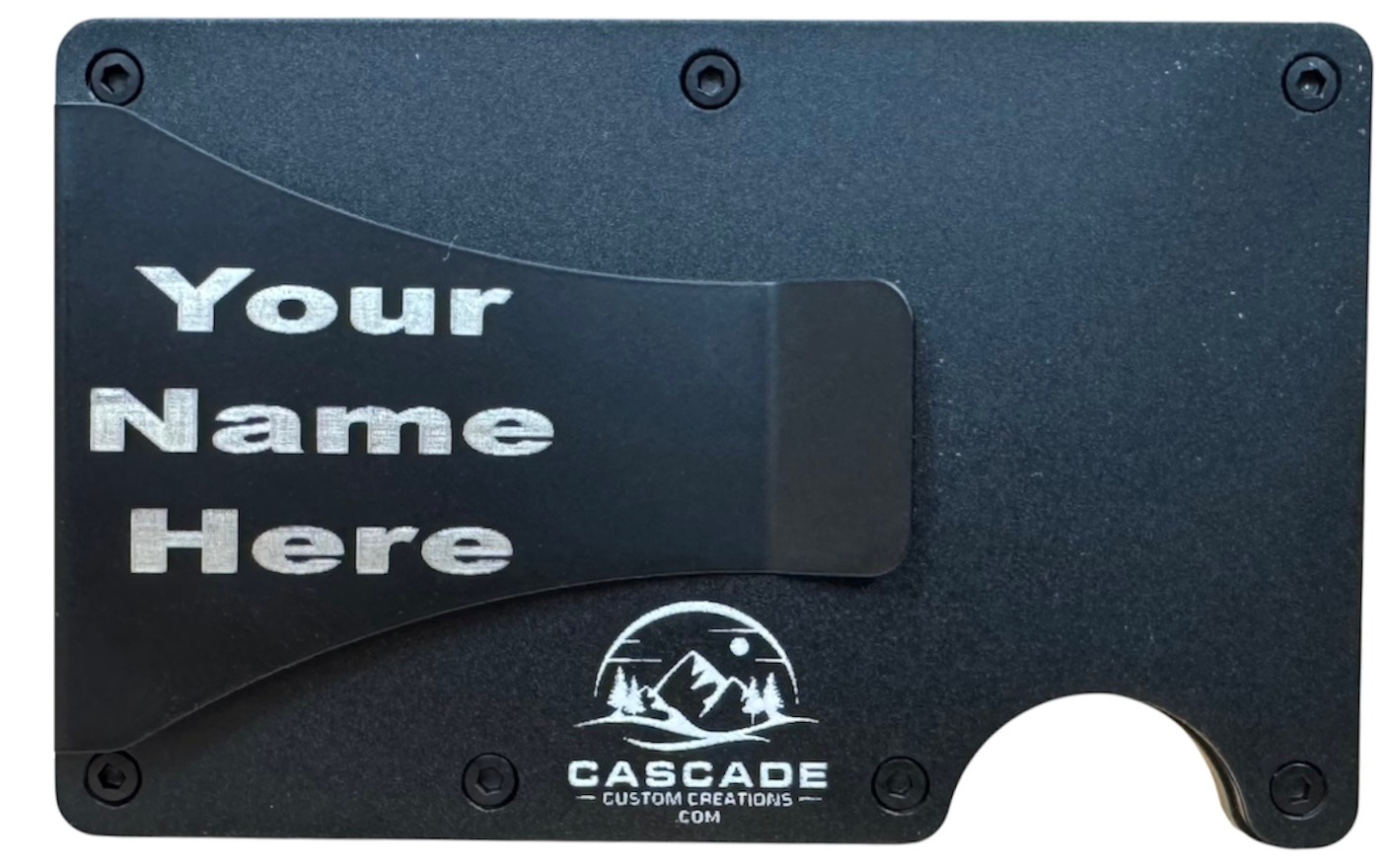 Back of a metal wallet showing a name laser engraved on the cash clip, to the left of the Cascade logo