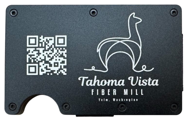 Tahoma Vista Fiber Mill logo and QR code laser engraved on a black metal wallet